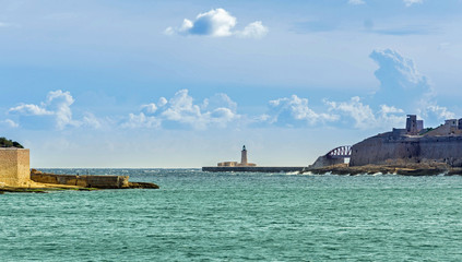malta impression - lighthouse at the harbor entrance