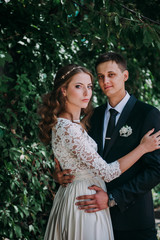 happy bride and groom at a park on their wedding day