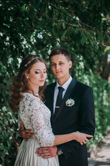 happy bride and groom at a park on their wedding day