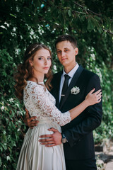 happy bride and groom at a park on their wedding day