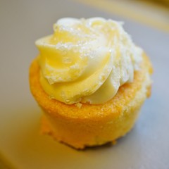 Mini lemon cupcake with white buttercream frosting