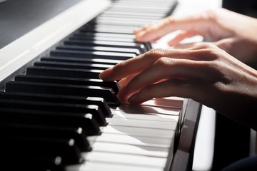 Obraz premium Playing Piano. close up