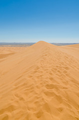 Fototapeta na wymiar Famous and inconic sahara sand dunes of Erg Chebbi in the Moroccan desert near Merzouga, Morocco, North Africa