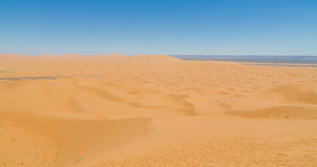 Fototapeta na wymiar Famous and inconic sahara sand dunes of Erg Chebbi in the Moroccan desert near Merzouga, Morocco, North Africa