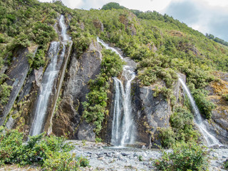 Fototapeta premium Waterfall near Franz Josef Glacier (Franz-Josef Gletscher) Westland National Park New Zealand