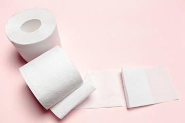 Toilet paper on pink background