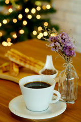 Obraz na płótnie Canvas black coffee with Homemade French Toast Sticks and hazelnut spread with bokeh background