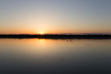 Fototapeta na wymiar a beautiful sunset on the river