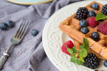 Belgian waffles with berries for breakfast