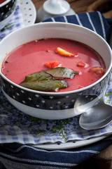Vegetarian red soup - borsch in green bowl.