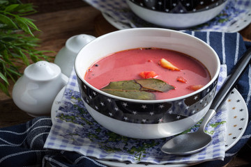 Vegetarian red soup - borsch in green bowl.