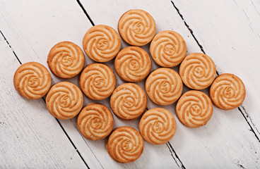 Tasty baked cookies on old wooden background.