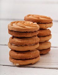 Fototapeta na wymiar Tasty baked cookies on old wooden background.