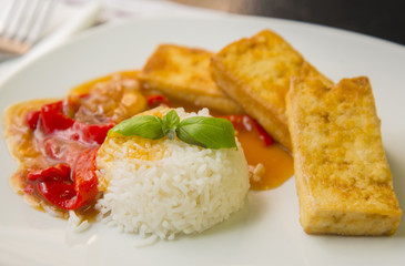 Rice with fried tofu cheese and vegetables sauce