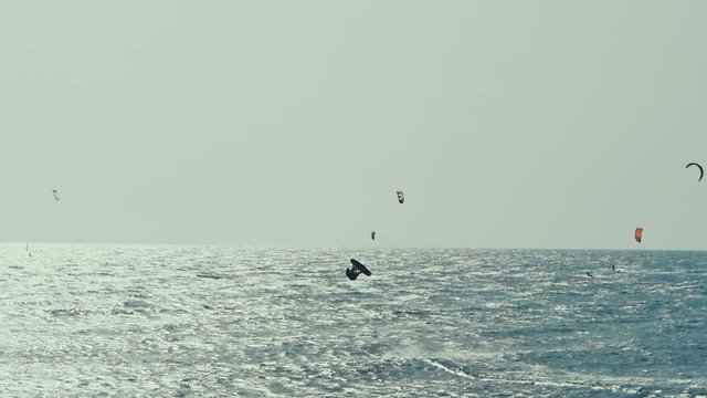 Kite Surfing in Atlantic Ocean, Extreme summer sport. Canary Islands, Spain. Slow motion.