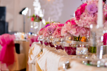 Arrangements with pink flowers on the table light side
