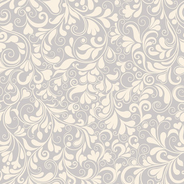 Seamless vector background with leaves, flowers and hearts