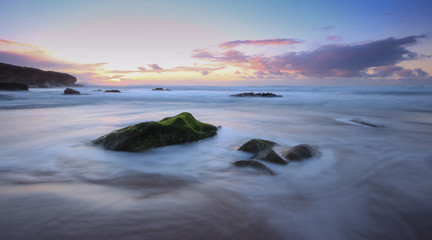 Amazing colours at the sunset in a beach, guincho beach cascais portugal. long exposure photo