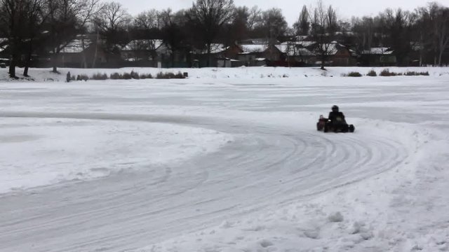 Racing takes place on an ice karting track of a frozen lake.