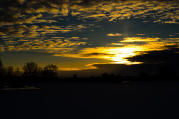 Beautiful sunset over the frozen river