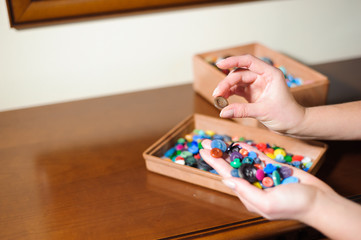 colorful sewing buttons in the hands