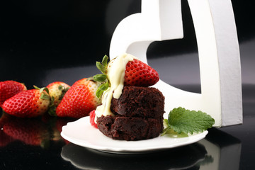 cake for Valentine day with chocolate, white chocolate and straw
