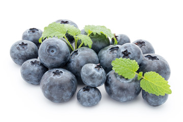 Close up of a blueberry branch isolated over white.