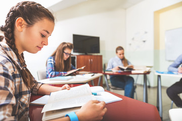 Serious girls in modern classroom
