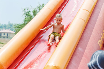 Boy on a water slide