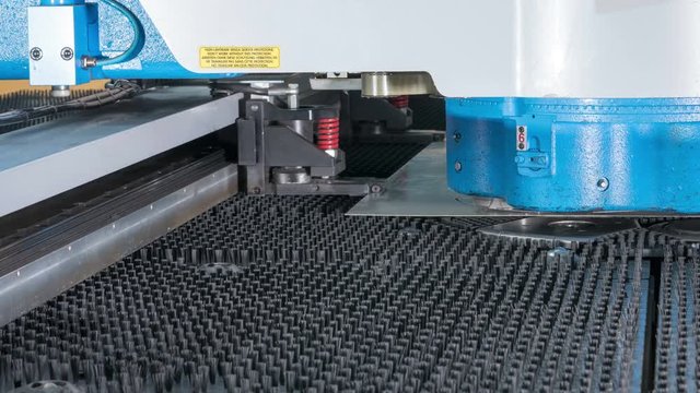 Timelapse high precision CNC Punching machine for sheet metal. Fast moving parts and receiving holes. Stamping parts.