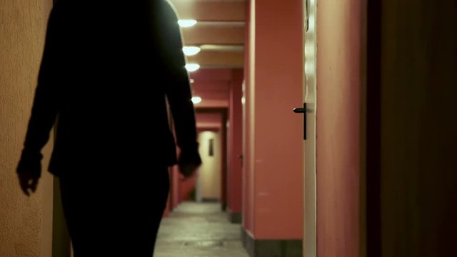 robber takes girl by force in a deserted building