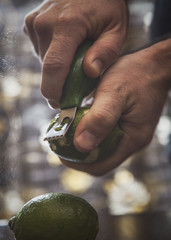 Man Zesting a Lime