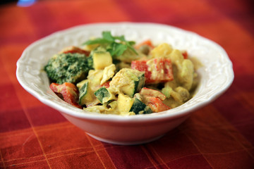 Homemade bell peppers and broccoli salad with spicy dressing on