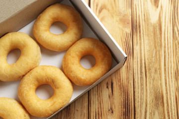 Delicious  donuts in a cardboard box