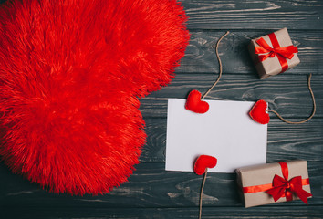 decorations for Valentine's Day. gifts, heart pillow, the word "love" and letter on wooden background
