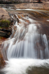 Waterfall close-up with brown rocks