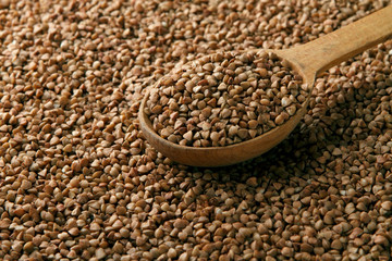 Buckwheat in a wooden spoon
