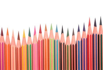 Wooden crayons perfectly sharpened placed in wavy row