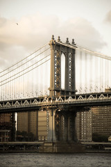 Fototapeta na wymiar Manhattan bridge and the river in old vintage style, New York