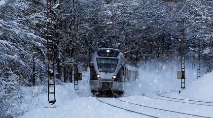 train speeding on a snowy winter day