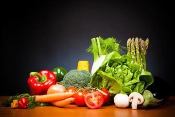Mixed Vegetabales On Table In Front Of Black Background