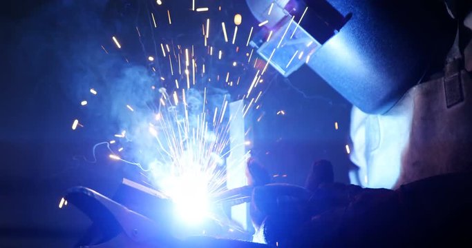 Welder welding a metal