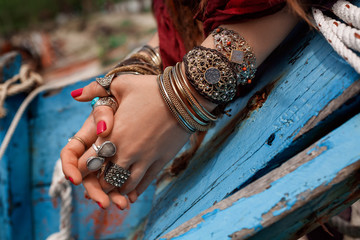 close up of gypsy style woman hands with jewelry