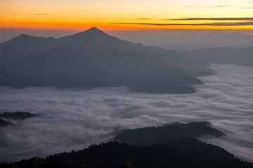 Fototapeta na wymiar Sunrise landscape of foggy and cloudy mountain valley, Doi Pha Tang chiang rai thailand