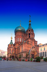 Fototapeta na wymiar famous harbin sophia cathedral in blue sky from square