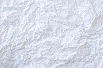 A white, crumpled paper as creative background