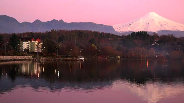 Lake Villarrica lake in Chile. Sailing, kayaking, sport fishing and water skiing are popular in the summer and a popular ski resort in the winter.The Villarrica Volcano, is south of the lake. 