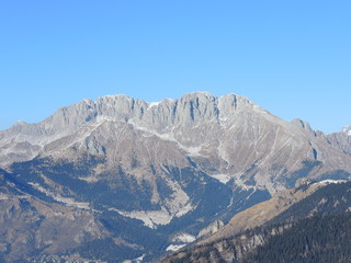 Fototapeta na wymiar Wonderful panorama from Monte Pora to Presolana in winter dry season. Orobie Prealps, Bergamo, Lombardy, Italy.