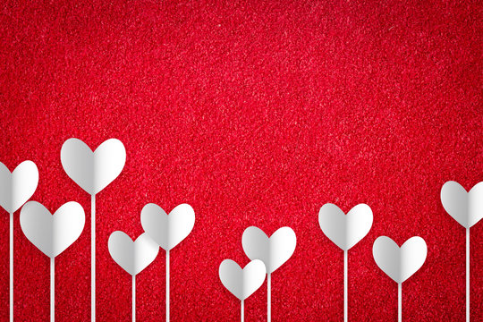 Valentine's day abstract background with cut paper heart on red carpet.

