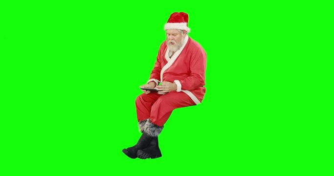 Santa claus doing christmas shopping online